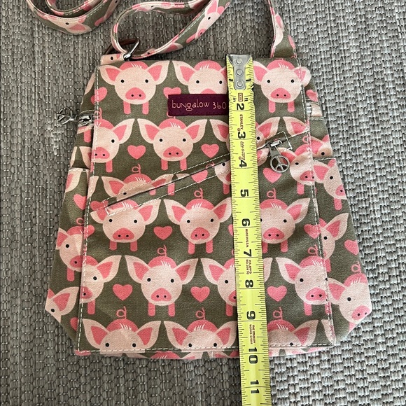 Bungalow 360 Whimsical Pig print canvas crossbody with peace sign zippers - Picture 6 of 15